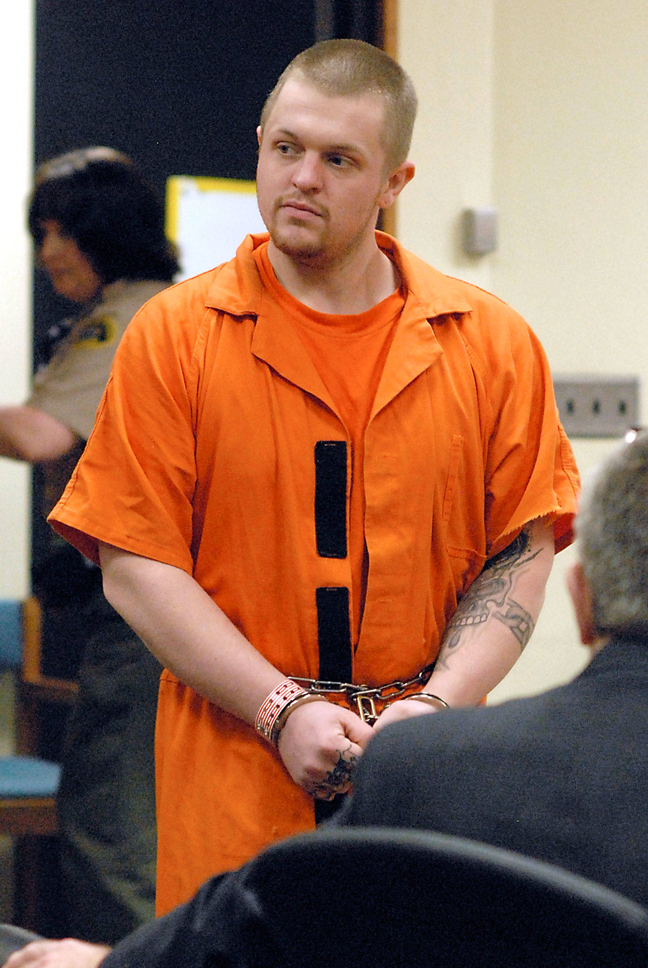 John W. Heckathorn of Port Angeles enters Clallam County Superior Court in Port Angeles for his first appearance Friday. (Keith Thorpe/Peninsula Daily News)