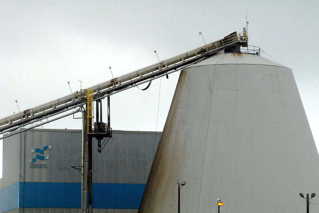 A conveyor belt hangs loose from the bottom of its track after a fire at the Nippon Paper Industries USA mill in Port Angeles on Friday. (Keith Thorpe/Peninsula Daily News)