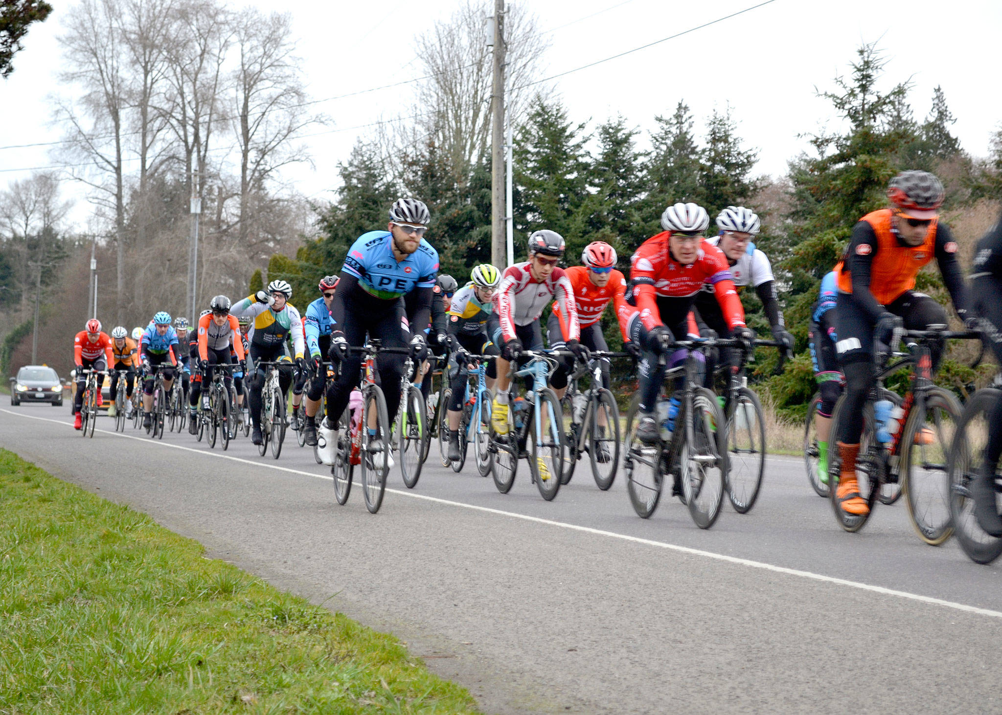 Matthew Nash/Olympic Peninsula News Group Riders in the Tour de Dungeness race along Woodcock Road on Saturday. The second leg of the Tour de Dungeness will take place next Saturday along the same roads around Sequim.