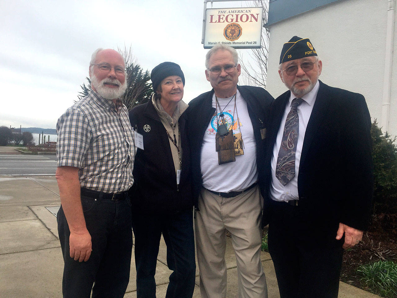 Carl Hanson, chair of COAST; deForest Walker, executive director of COAST; Chaplain Richard Nordberg, and Andy Okinczyc, American Legion Post 26 commander, stand in front of the American Legion which hosts the winter shelter in the building’s lower level. (Cydney McFarland/Peninsula Daily News)