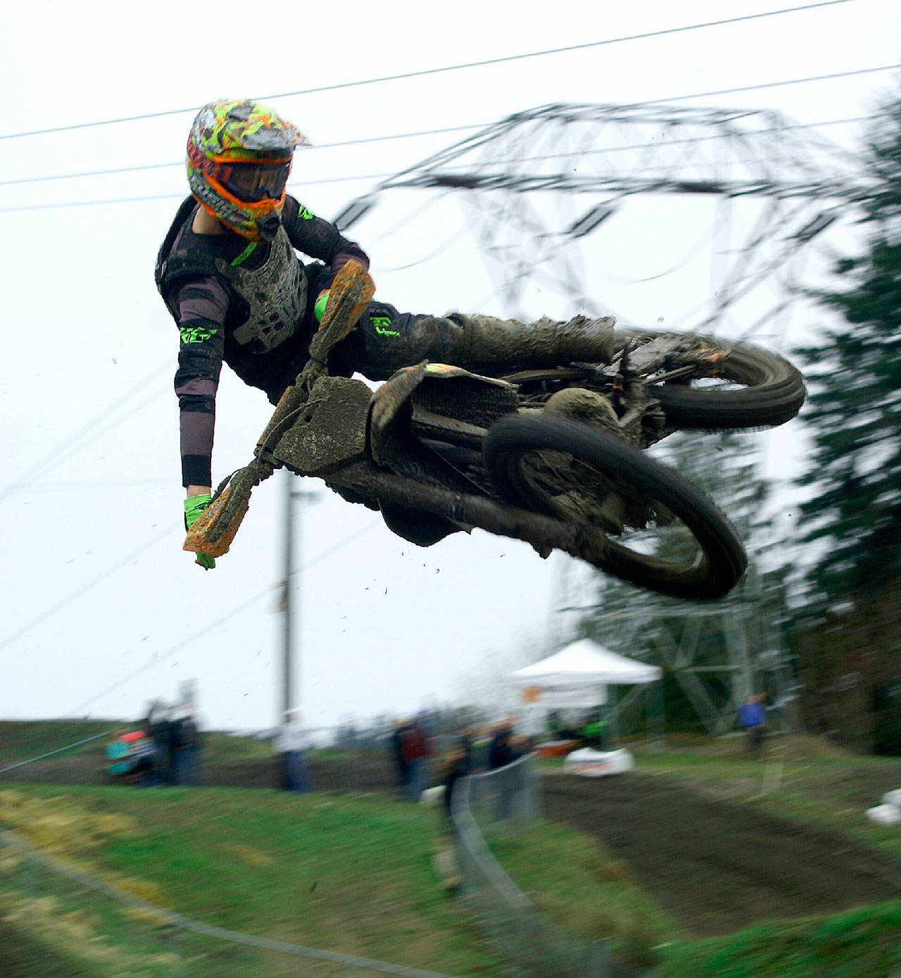 Tom Hines Port Angeles’ Jake Anstett crosses the finish line on his KTM 250cc 2-stroke motorbike to win the 450cc Class A Pro Rider race during the first race of the season at Olympic Peninsula Motorcycle Club off Deer Park Road. Anstett earned his second win of the day and first place overall in the first two rounds of the Washington State Series cosponsored by the Northwest Racing Association. The next races are May 20-21. Visit www.opmc.org for more information.