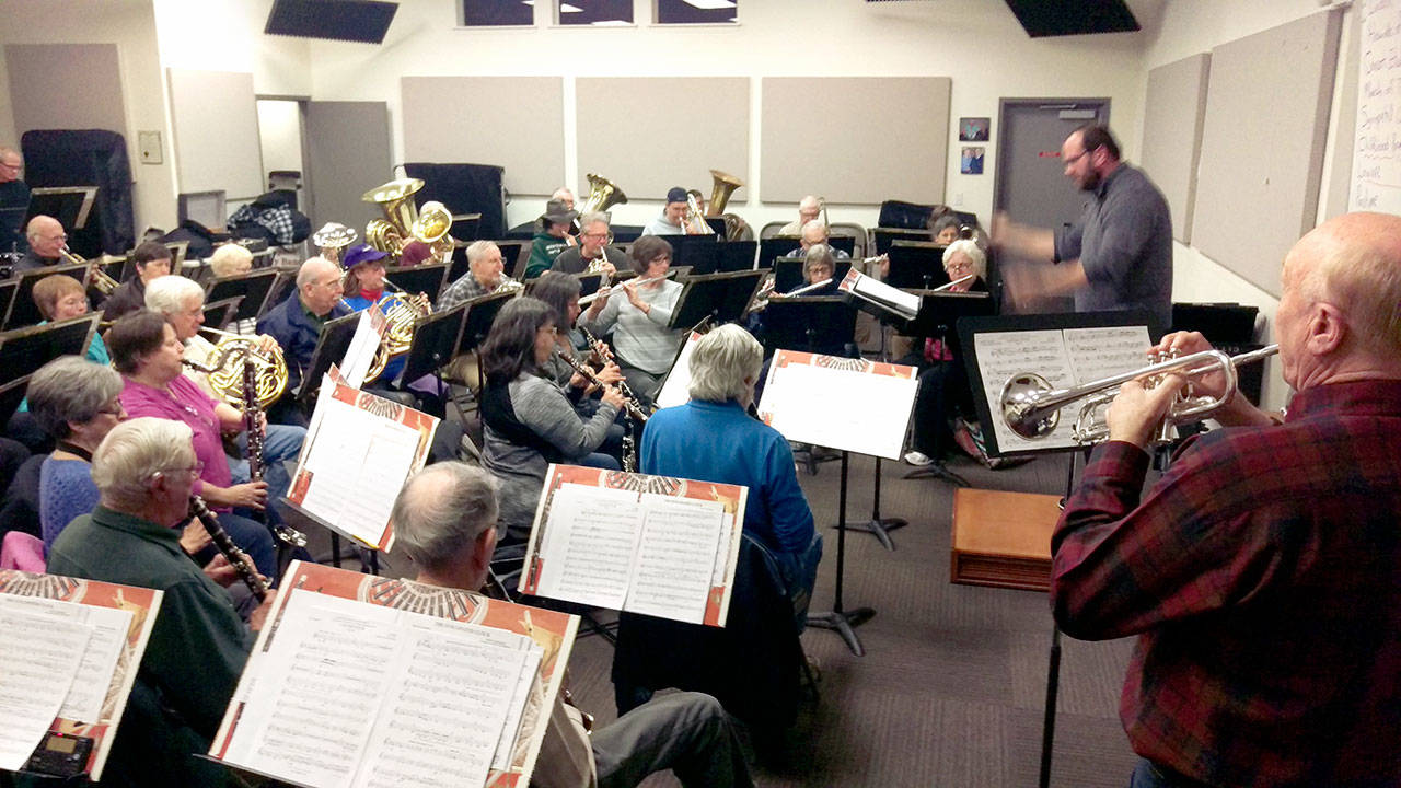 The Sequim City Band under the direction of Tyler Benedict accompanies soloist Randy Stillwell.