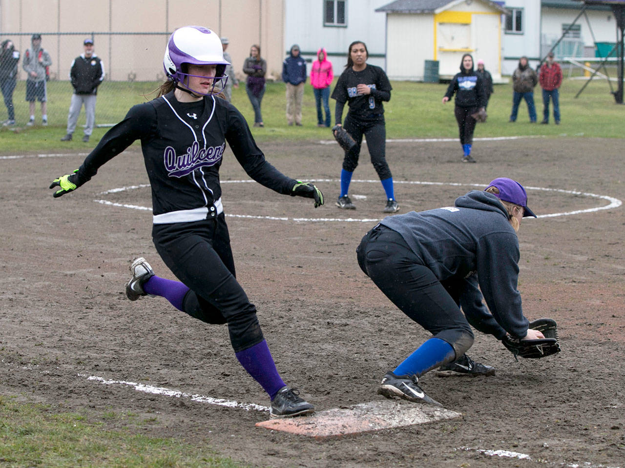 Steve Mullensky/for Peninsula Daily News Quilcene’s Allison Jones legs out a base hit during the Rangers’ 11-1 win over La Conner on Friday.