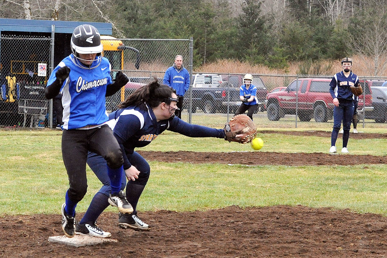 Lonnie Archibald/for Peninsula Daily News Chimacum’s Taylor Carthum beats the throw to Forks first baseman Kierra Brandt during this nonleague contest held at Beaver’s Orr Field where the Spartans defeated Chimacum 13 to 11. Looking on is Forks pitcher Jayden Olson. Lonnie Archibald/for Peninsula Daily News Chimacum’s Taylor Carthum beat the throw to Forks first baseman Kierra Brandt during this nonleague contest held at Beaver’s Orr Field where the Spartans defeated Chimacum 13 to 11. Looking on is Forks pitcher Jayden Olson.