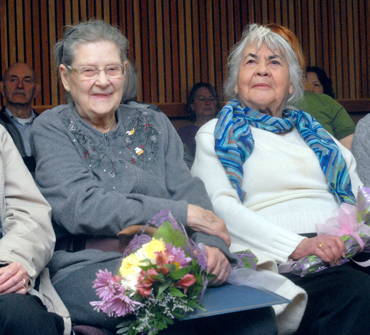 American Red Cross volunteers Jo Oliver, left, and Dianna Cross sit in commissioners meeting room at the Clallam County Courthouse in Port Angeles on Tuesday after being honored by the commission for their long-standing service with the disaster-relief agency. (Keith Thorpe/Peninsula Daily News)