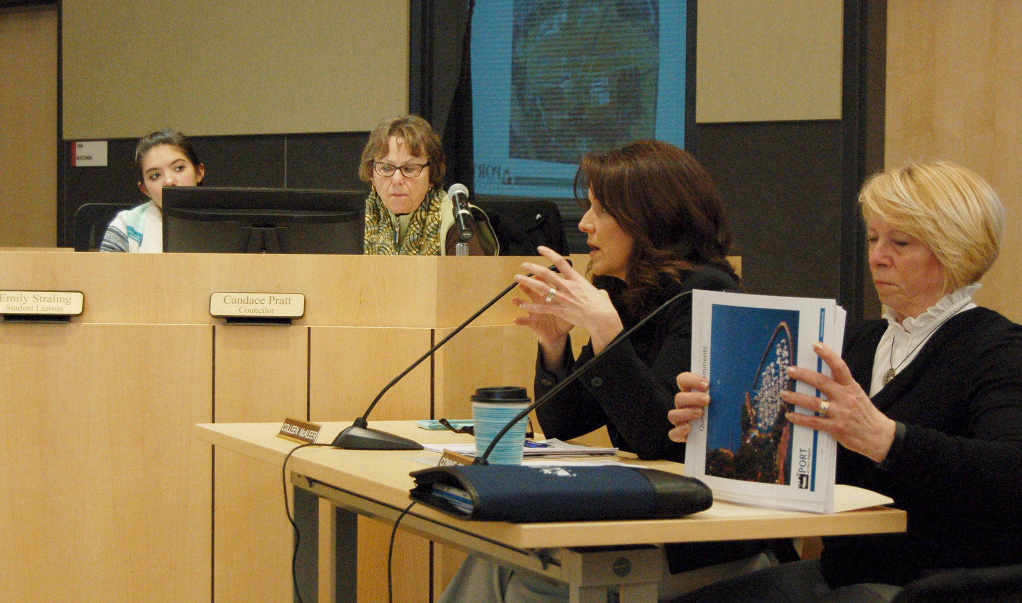 Erin Hawkins/Olympic Peninsula News Group Port Commissioner Colleen McAleer, center, presents some of the goals of the port commission with Port Commissioner Connie Beauvais, right, to Sequim City Council members.