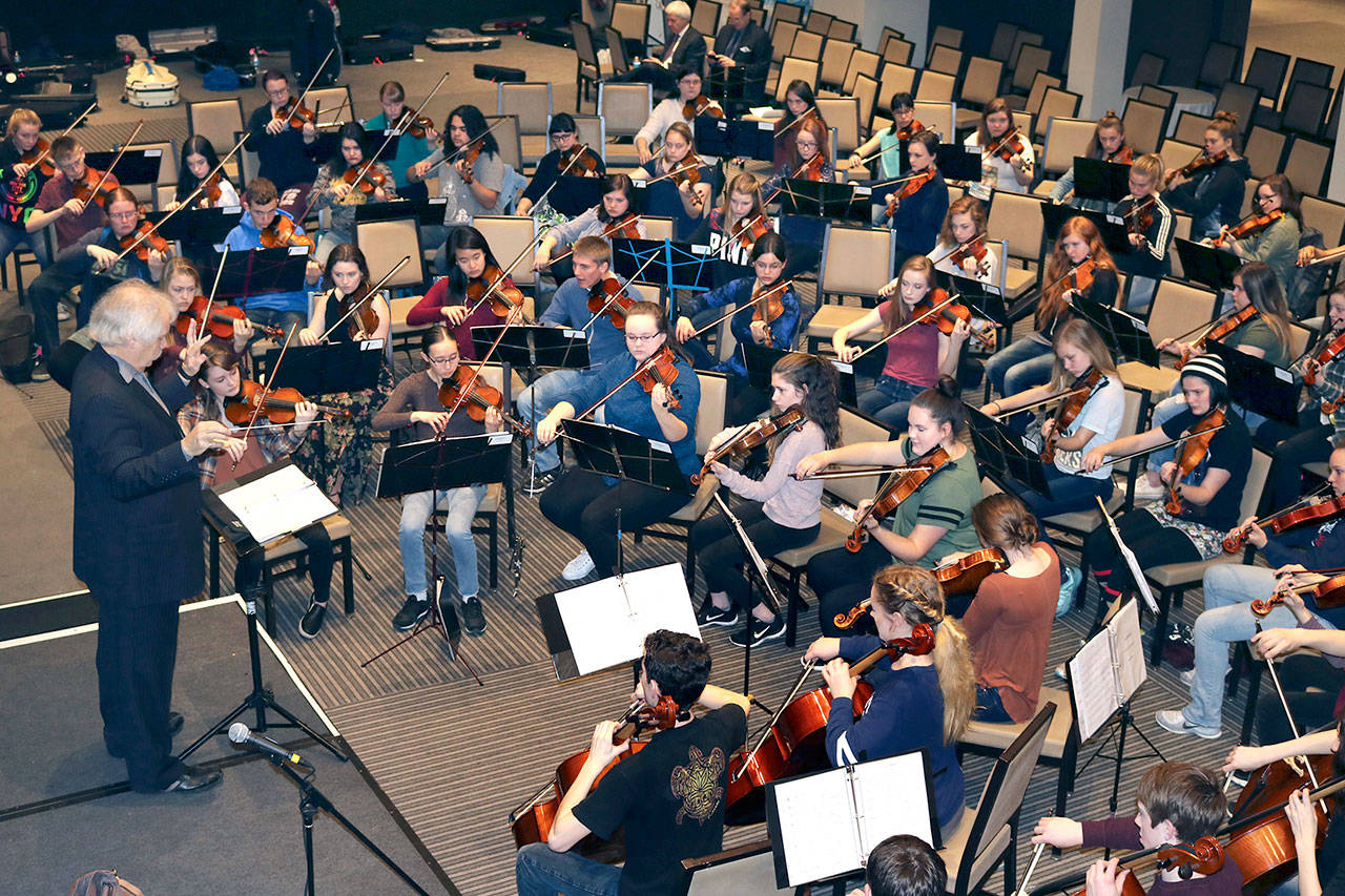 Ron Jones directs a rehearsal for the Port Angeles High School Symphonic Orchestra at Park Central Hotel near Carnegie Hall in New York City. The group is scheduled to take the Carnegie Hall stage today.