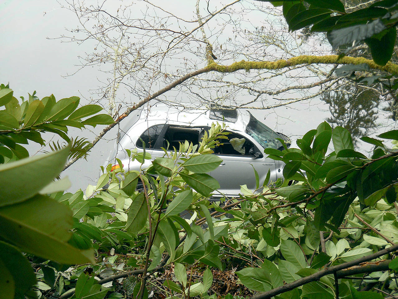 A PT Cruiser ended up in the water near Port Ludlow after crossing out of its lane Tuesday. (Port Ludlow Fire Rescue)