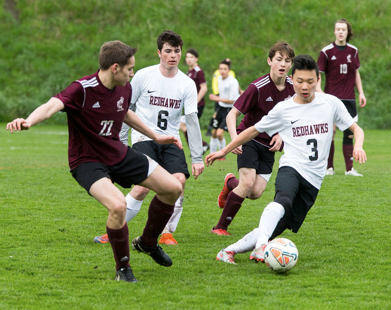 Steve Mullensky/for Peninsula Daily News Port Townsend’s Aaron Lee, boots the ball away from Ketchikan’s Brent Taylor during a friendly game at Memorial Field in Port Townsend.