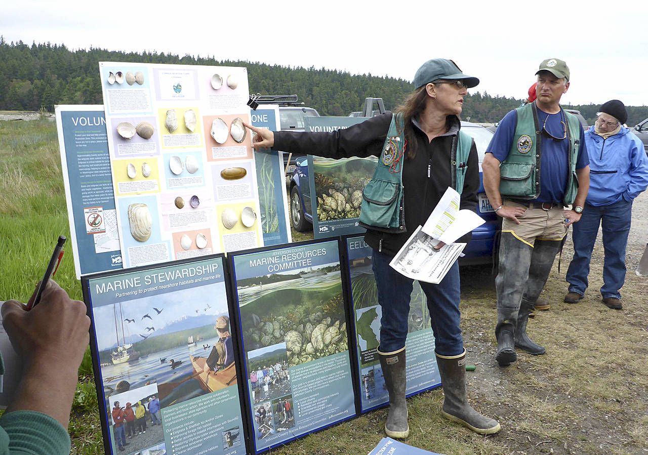 Jefferson Marine Resources Committee State Department of Fish and Wildlife biologist Camille Speck explains types of clams to attendees of the 2016 Digging for Dinner shellfish harvesting clinic in Jefferson County.