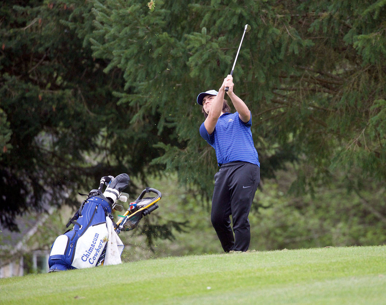 Steve Mullensky/for Peninsula Daily News Chimacum’s Logan Storm watches the flight of his drive on a par three at Port Ludlow Golf Club on Tuesday. Storm shot the low round of the day, a 42.