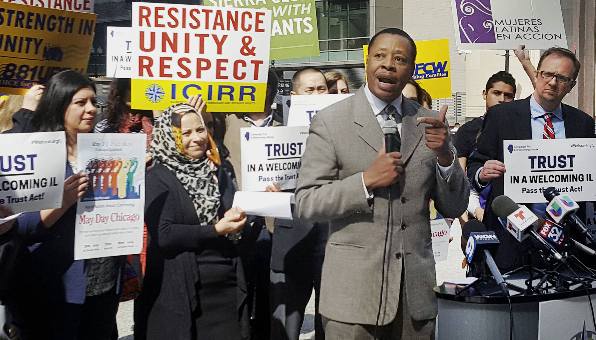 In this April 24 photo, Pastor Don Taylor of a suburban Chicago organizing group speaks to immigrant rights advocates in downtown Chicago. The advocates plan to march in a May 1 rally in Chicago. (The Associated Press)