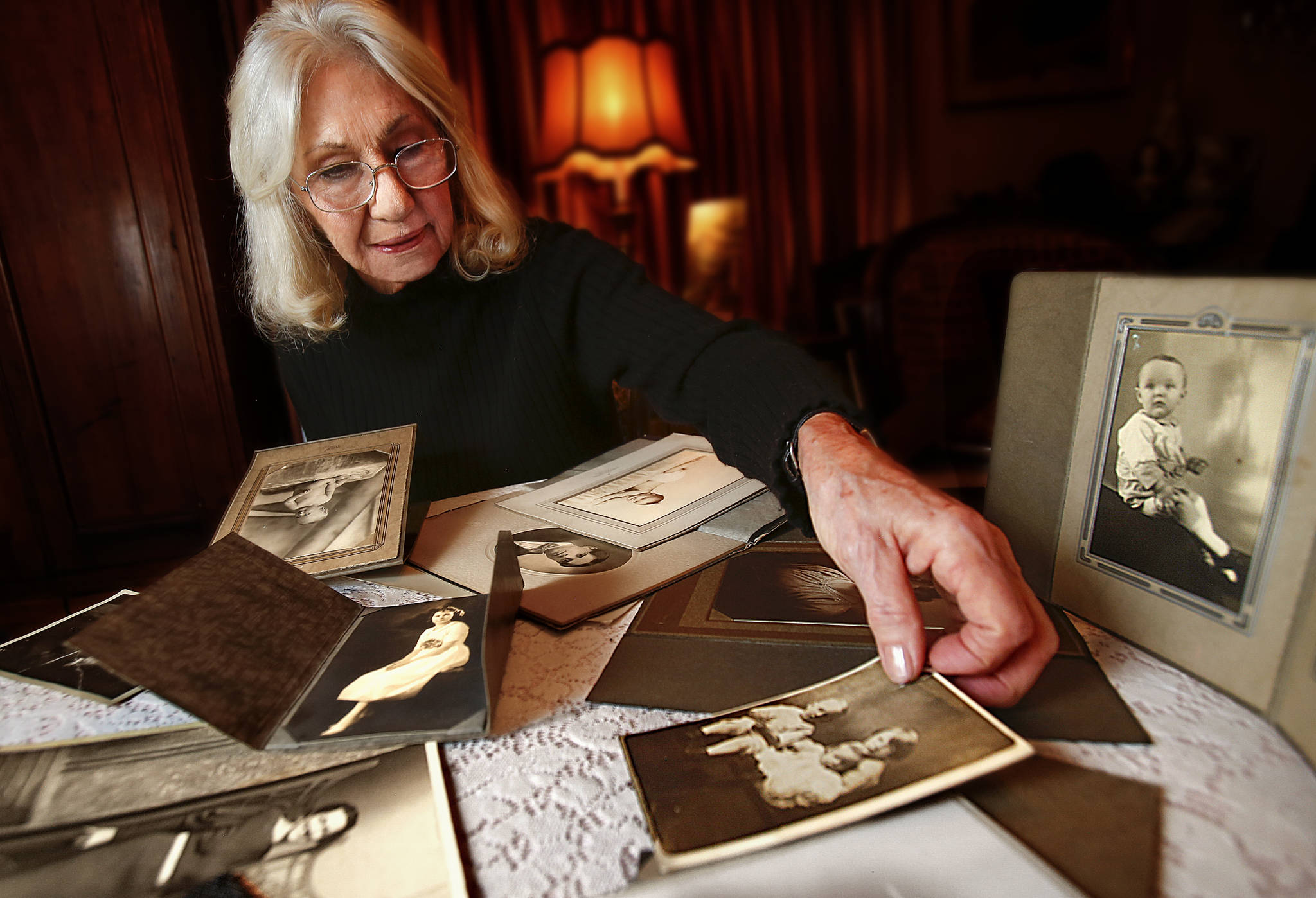 Dan Bates (2)/The Herald via AP Everett’s Lorna Donadio has been collecting old photos she finds at garage sales, some dating back as far as 1911. As time passes, the 77-year-old Donadio wants them to have a home.