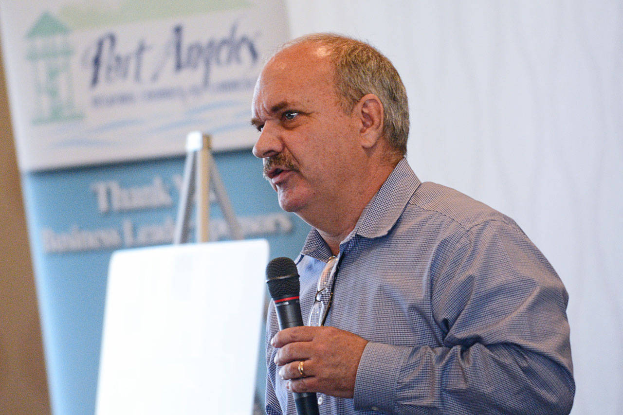 Steve Burke, executive director of William Shore Memorial Pool in Port Angeles, tells those who attended Wednesday’s Port Angeles Regional Chamber of Commerce luncheon of the planned expansion for the pool. (Jesse Major/Peninsula Daily News)