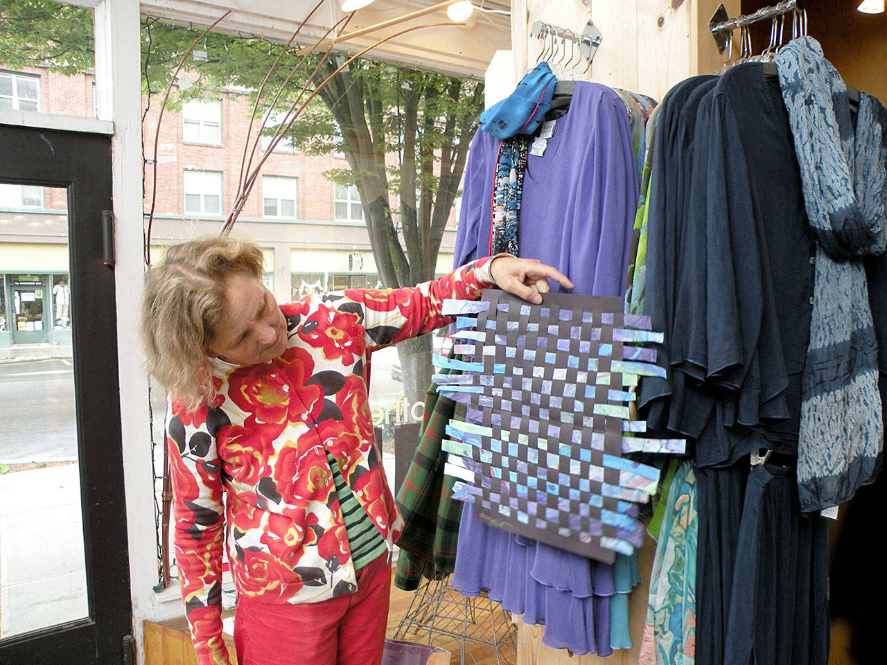 Helen Gunn of Port Townsend holds art from a local child submitted for last year’s Art Wave. (Port Townsend Main Street Program)