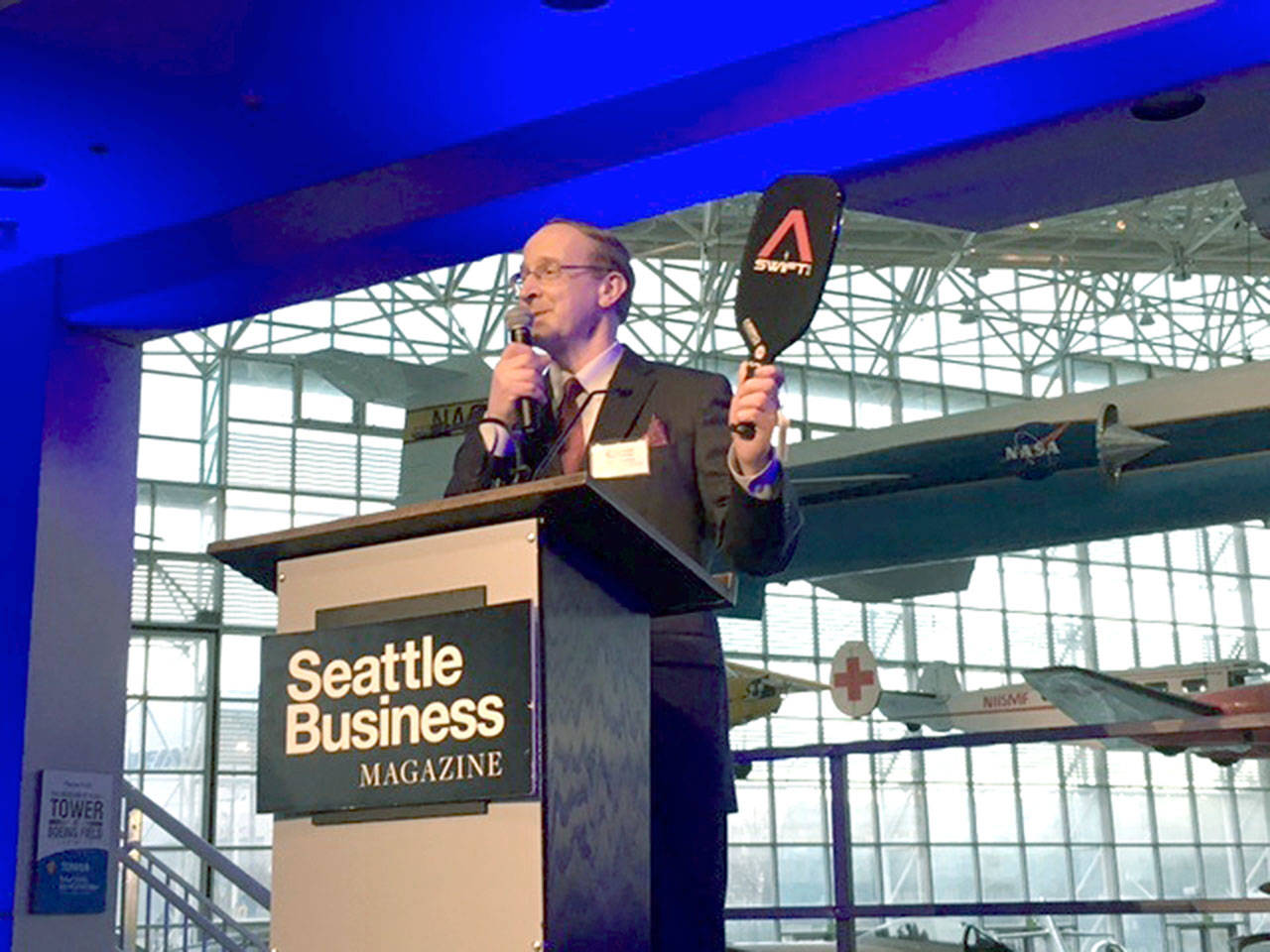 Chief Operations Officer Dave Walter shows off the Composite Recycling Technology Center’s first product, the Aero Paddle-brand Swift pickleball paddle, at the Washington Manufacturing Awards event, held at the Seattle Museum of Flight on April 26.