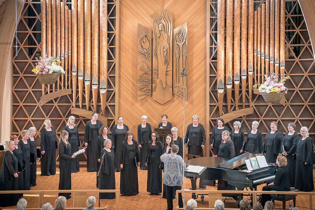 Joy A. Lingerfelt directs the NorthWest Women’s Chorale on May 9, 2016, at Holy Trinity Lutheran Church in Port Angeles. (Charlotte Watts)