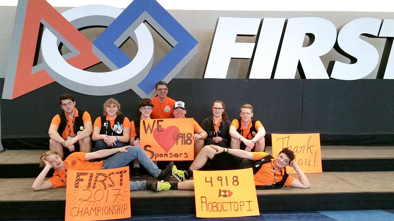 The Port Townsend Roboctopi team — Sam Jasper, Spencer Drewry, Pallas Burhen, Max Morningstar, Chance Kane, JR Kienle, Ella Ashford, Emily Skeel and Aaron Robert, from left — competed with roughly 400 teams from around the world at the FIRST Robotics competition in Houston. (Port Townsend Roboctopi)