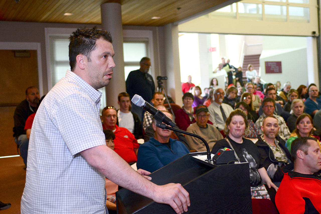 Chad Westenhaver, chair of the Port Angeles Oxford House chapter, asks how the city can help Oxford House, which provides housing for recovering addicts, expand in Port Angeles. (Jesse Major/Peninsula Daily News)