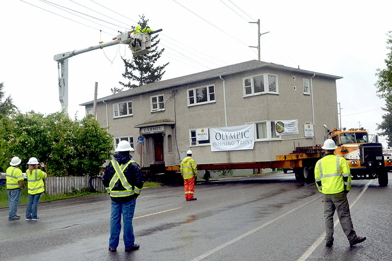Apartment building trucked through Port Townsend to provide low-cost housing