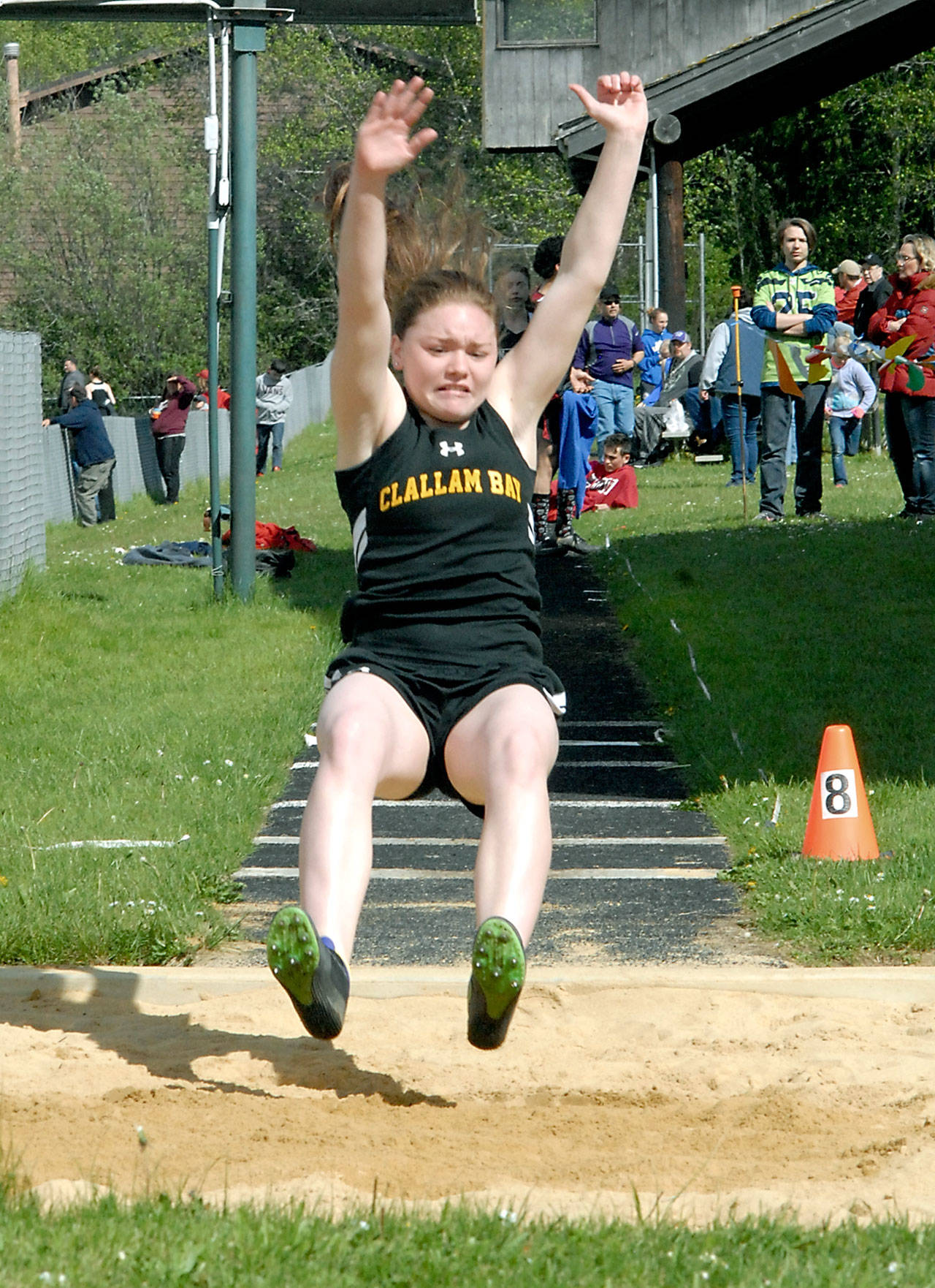 Keith Thorpe/Peninsula Daily News Hannah Olson of Clallam Bay competes in the long jump during the North Olympic League Sub District Meet at Crescent High School in Joyce.