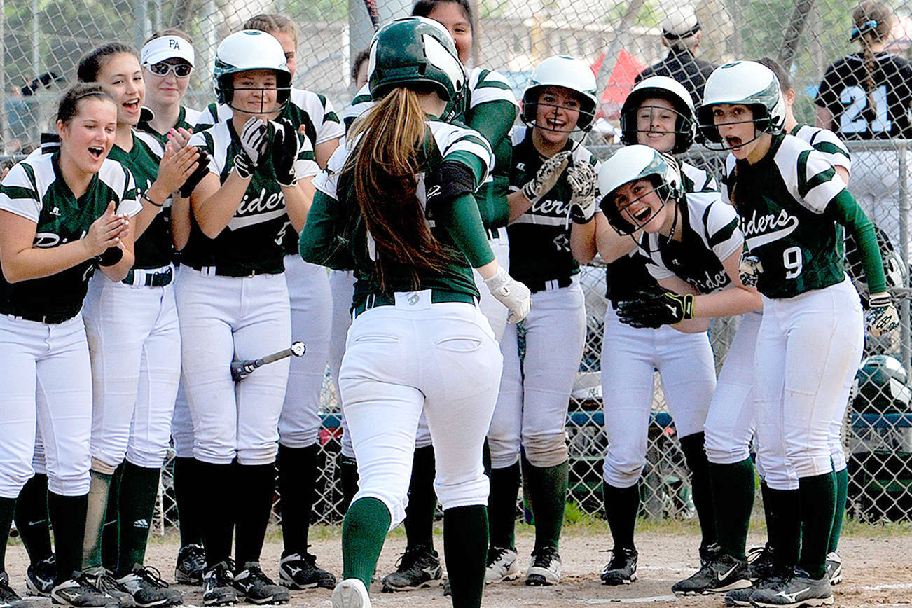 DISTRICT SOFTBALL: Rider girls muscle up