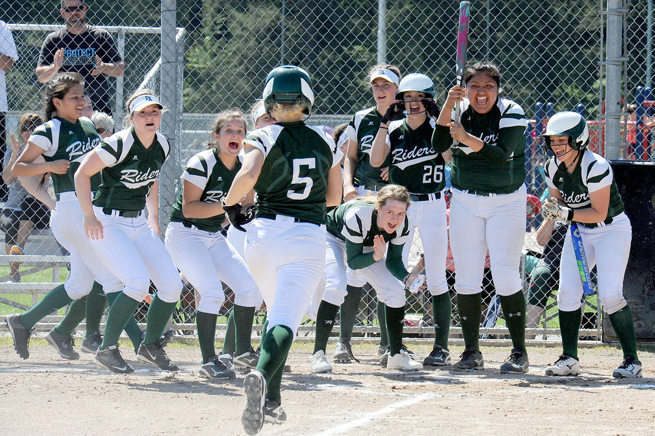 Lonnie Archibald/for Peninsula Daily News Port Angeles’ Natalie Steinman, 5, reaches home plate to a resounding welcome after hitting a two-run home run in the Riders’ 13-2 win over White River in the district championship last Saturday.