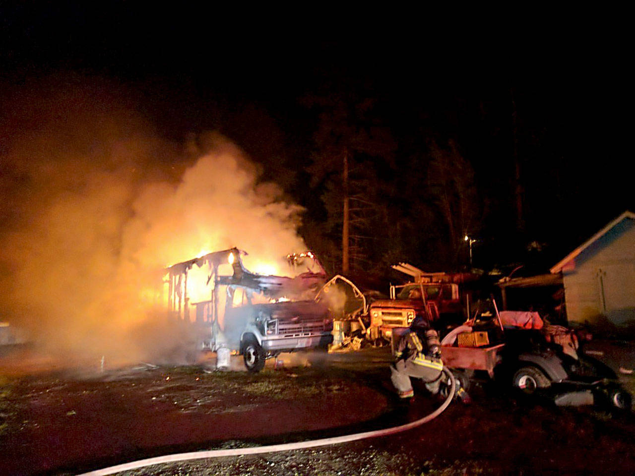 A trailer burns on the 600 block of O’Brien Road in Sequim late Tuesday night. (Clallam County Fire District No. 3) 