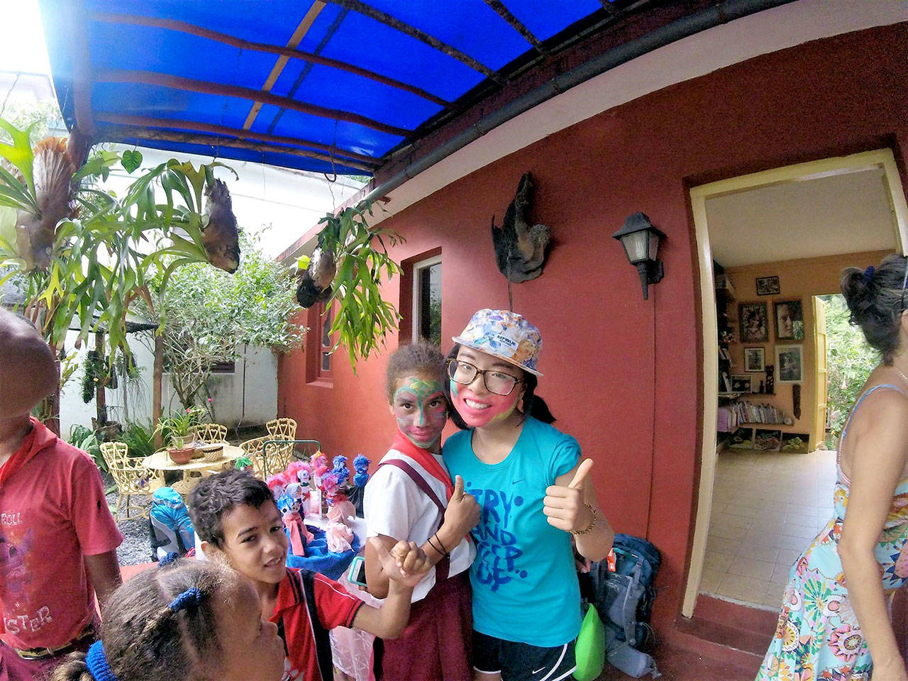Jefferson Community School student Jocelyn poses for a photo with some kids in Cuba. (Jefferson Community School)