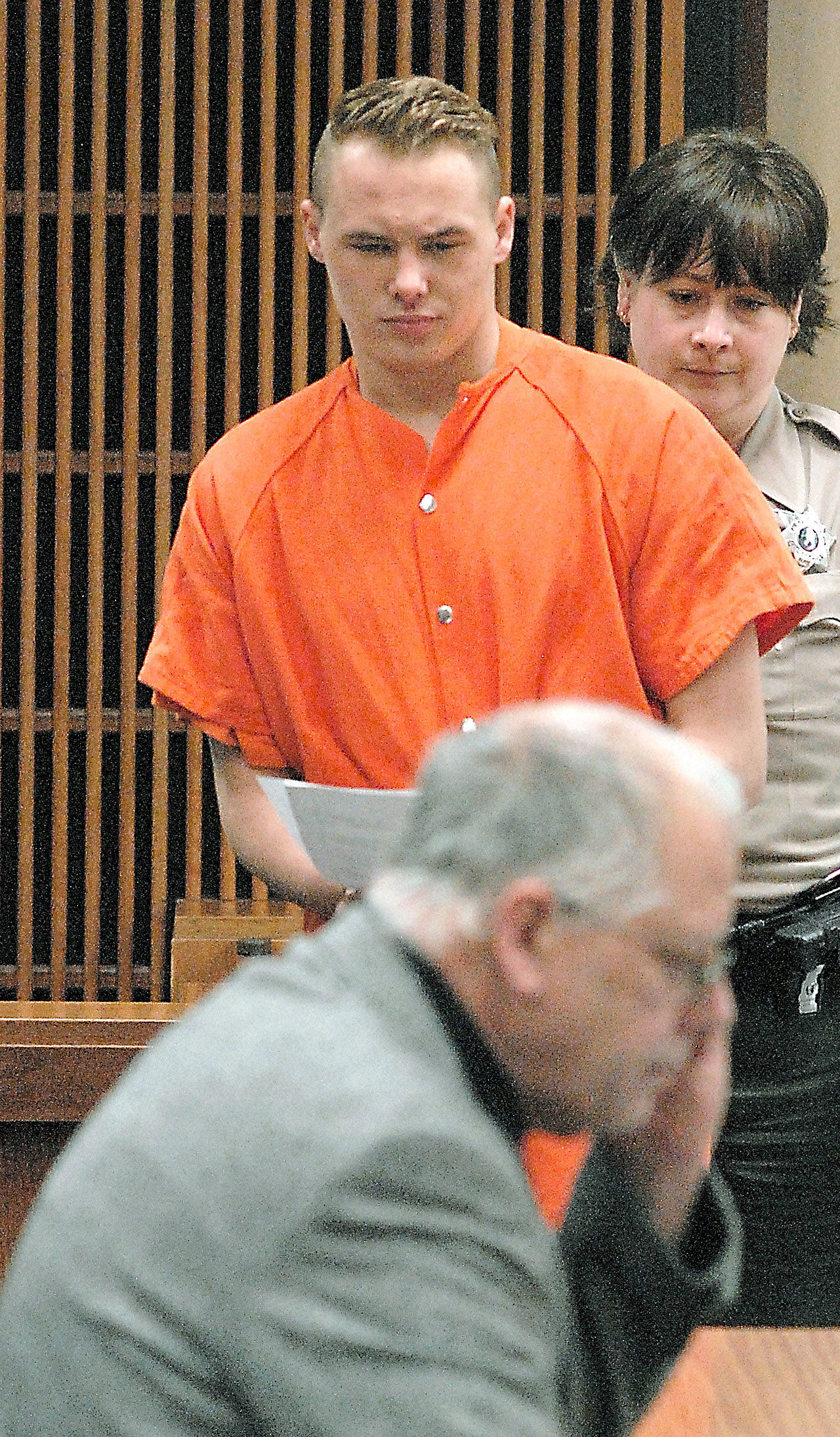 Benjamin Bonner approaches defense attorney Harry Gasnick during Bonner’s first appearance in Clallam County Superior Court earlier this month on charges of second-degree murder, animal curelty and theft of a motor vehicle. (Keith Thorpe/Peninsula Daily News)