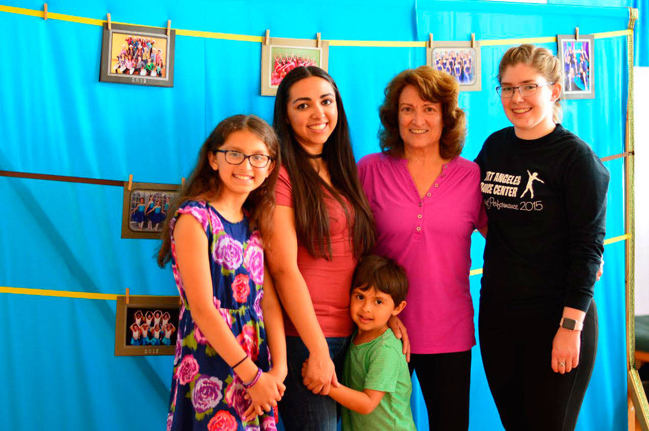 Mary Marcial, second from right, pauses at the Port Angeles Dance Center with, from left, her granddaughter, Amara Gonzalez, 10; daughter Catalina Gonzalez; grandson Tomás Gonzalez, 4; and soloist Elizabeth Helwick. (Diane Urbani de la Paz/for Peninsula Daily News)