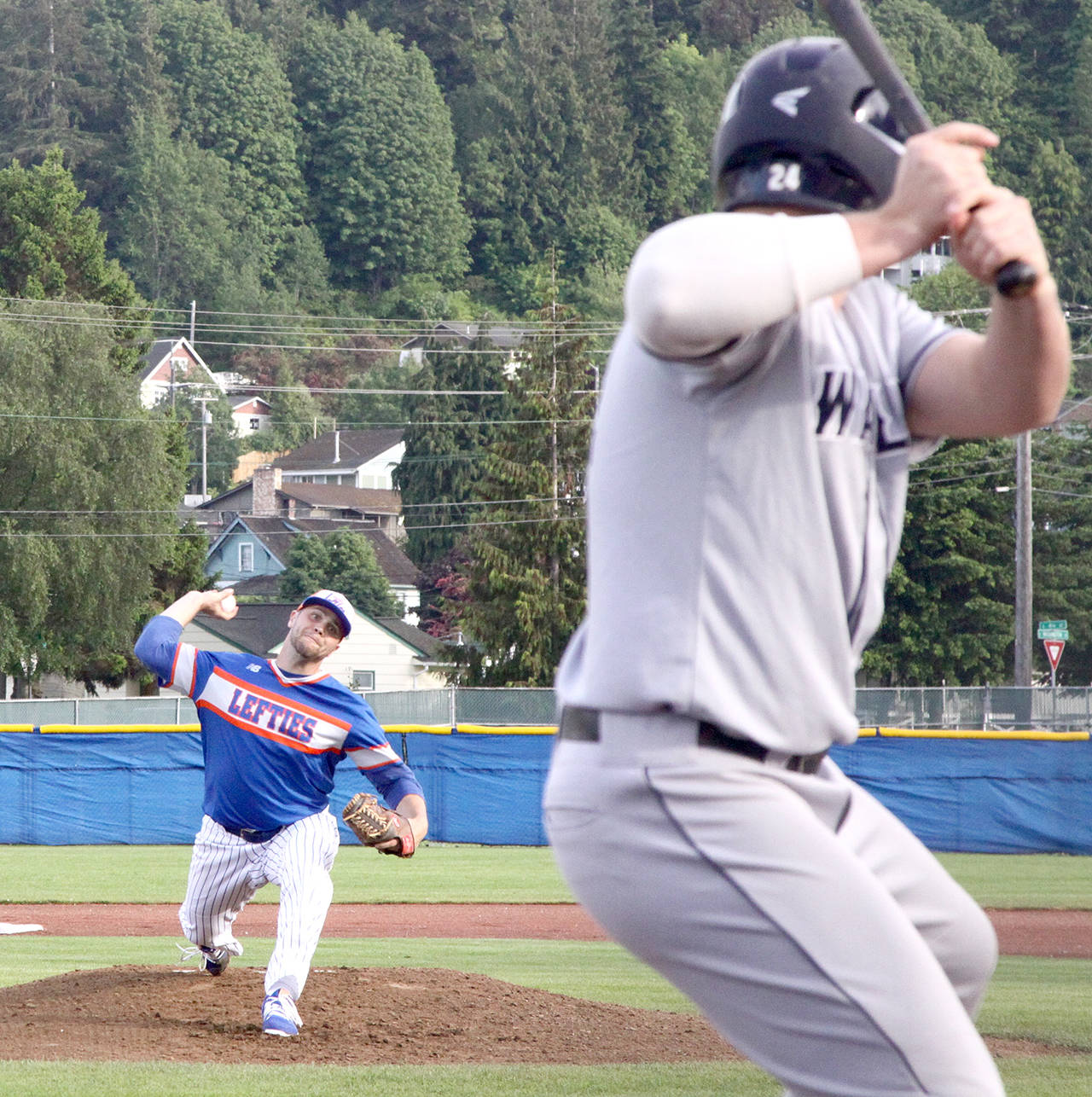 Lefties starting pitcher Luke Fraley prepares to deliver a pitch to Walla Walla’s NickNyquist during Port Angeles’ 4-1 win on Friday. Fraley took a no-hitter into the ninthinning before the Sweets broke it up with a ground-ball single.                                 (Dave Logan/for Peninsula Daily News)