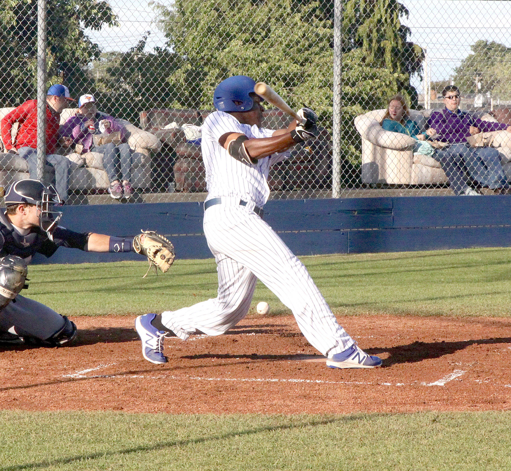 Dave Logan/for Peninsula Daily News Port Angeles Lefties center fielder Alex Junior fouls a ball off against Walla Walla Saturday. Junior hit two doubles in the Lefties’ 8-2 win, driving in a pair of runs.
