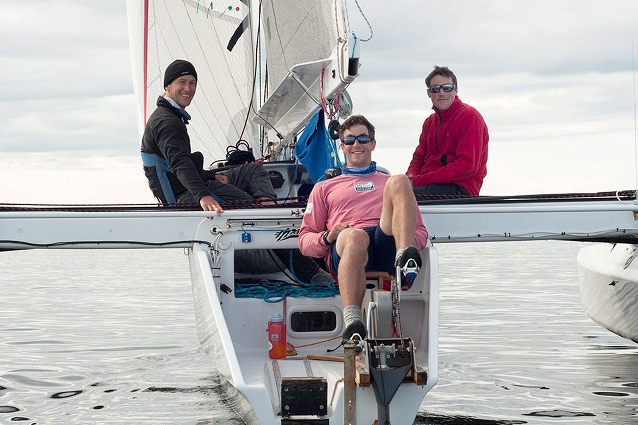 Brothers Tripp, Chris and Trevor Burd of Team Pure & Wild/Freeburd were the first to cross the finish line in Ketchikan after 750 miles of sailing and peddling. Credits: (Daphne Stuart/R2AK)