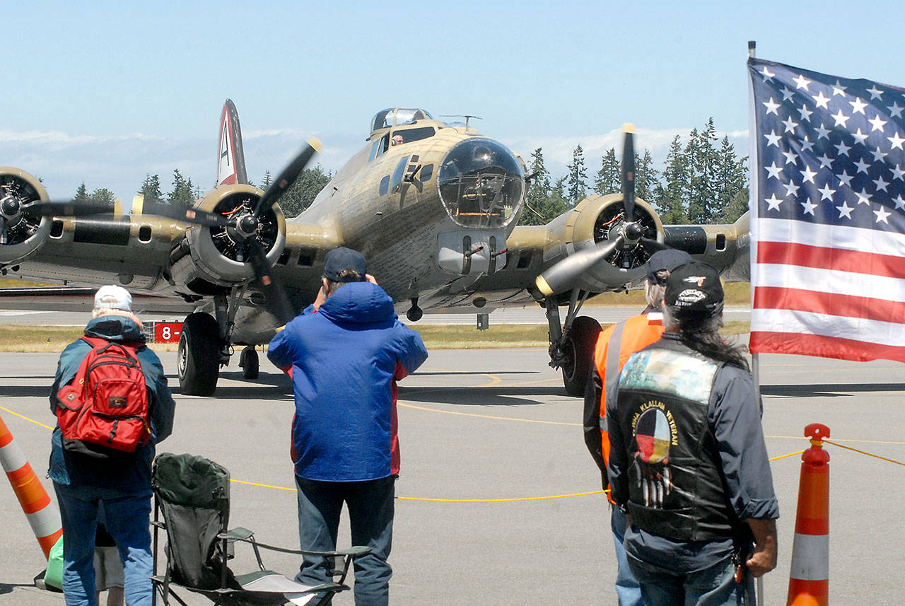 The Wings of Freedom’s B-17 bomber taxis into the tarmac Wednesday after taking a group of World War II veterans on a complimentary ride. (Keith Thorpe/Peninsula Daily News)