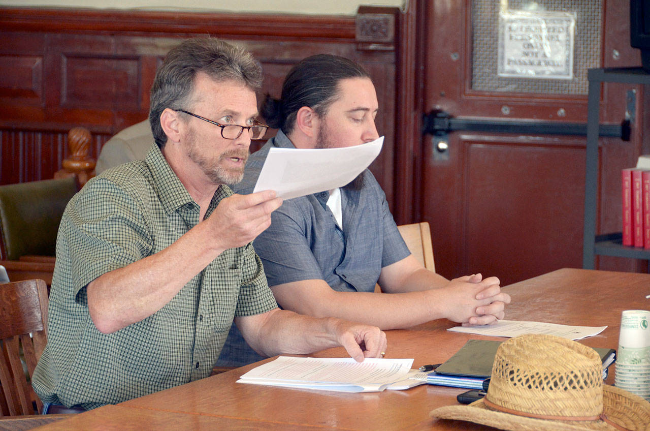 Kevin Coker, representing Austin Smith of Olympus Gardens, speaks at a public hearing that was called due to public opposition to a proposed marijuana growing and processing operation on Marrowstone Island. (Cydney McFarland/Peninsula Daily News)