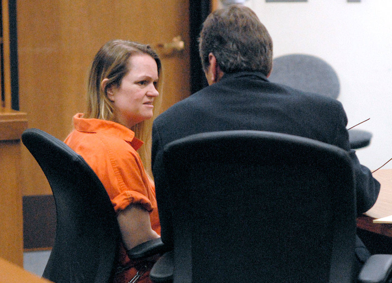 Deanna Wilson, left, confers with attorney John Black during Wilson’s sentence hearing Wednesday in Clallam County Superior Court in Port Angeles. (Keith Thorpe/Peninsula Daily News)