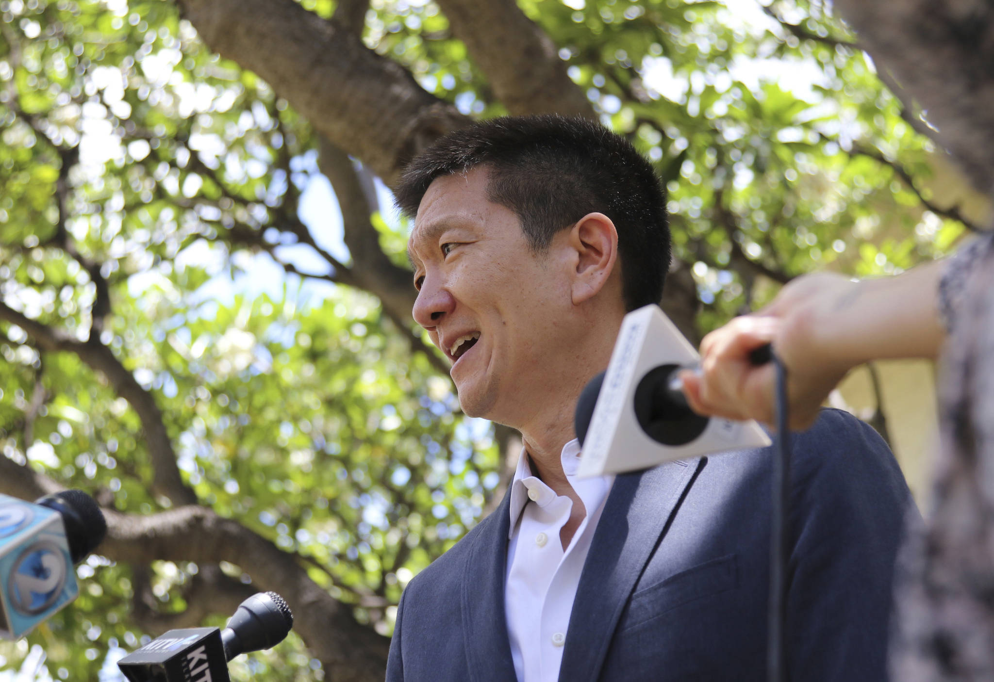 Hawaii Attorney General Douglas Chin talks about a U.S. appeals court decision on President Donald Trump’s revised travel ban Monday in Honolulu. (Caleb Jones/The Associated Press)