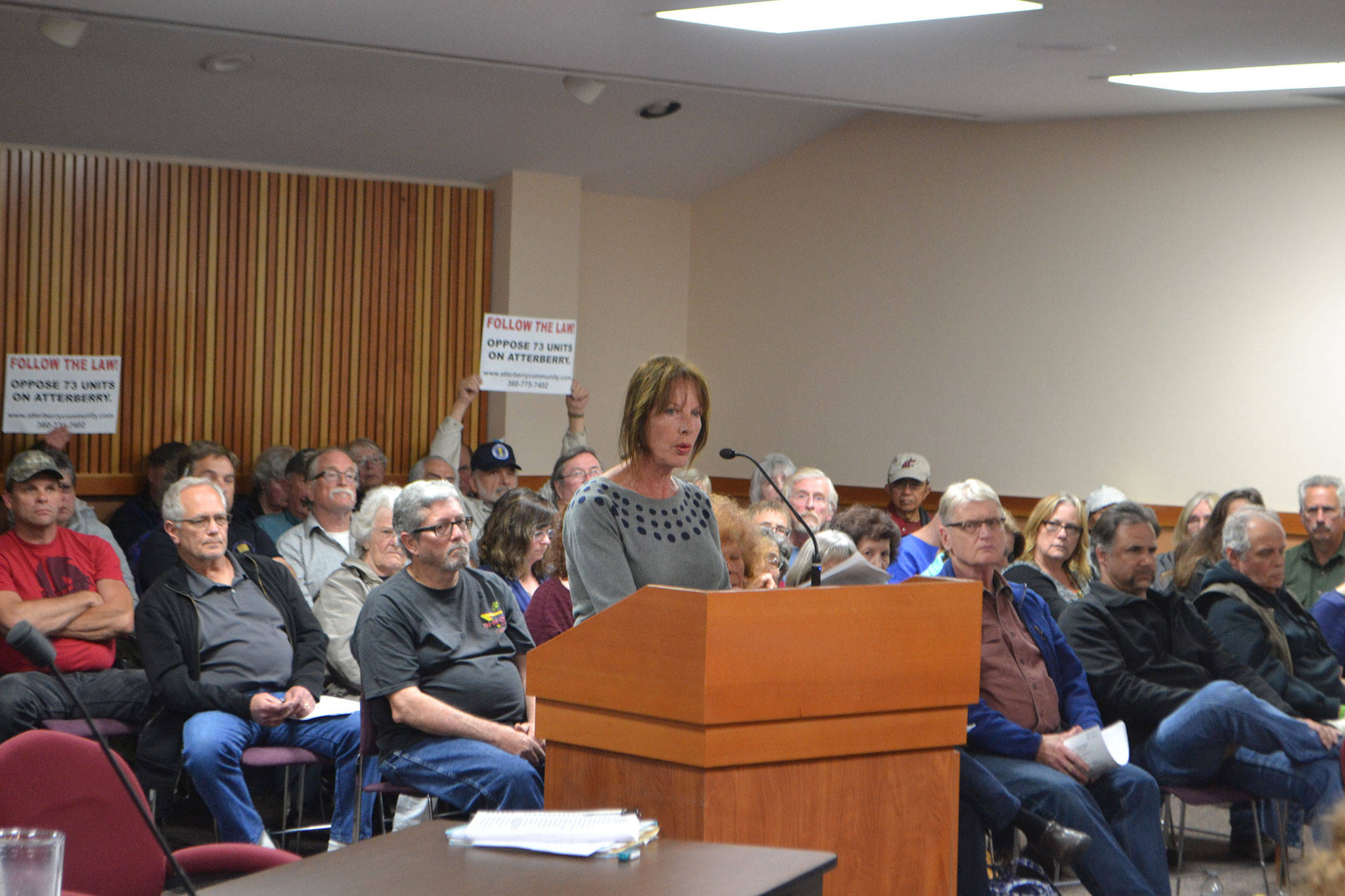 Matthew Nash (2)/Olympic Peninsula News Group                                Debra Stevens, a resident on Atterberry Road and retired city planner, speaks during a public comment session June 1, in the Clallam County Courthouse about a proposed 73-unit manufactured housing development at the intersection of Atterberry and Hooker roads. She said Matriotti Creek should see a buffer of 150 feet due to its classification in Clallam County’s Critical Areas Map and a full environmental review should be done on the site.