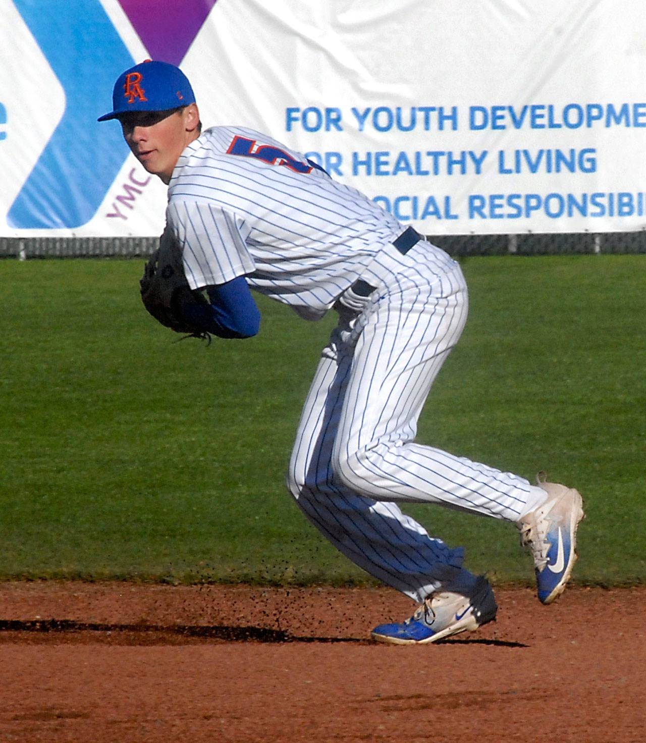 The Lefties’ Kevin Kendall prepares to throw to first in a June 20 game against the Bend Elks at Civic Field. Kendall, 18, will be a freshman at UCLA this fall and is one of the youngest players in the West Coast League.                                Keith Thorpe/Peninsula Daily News