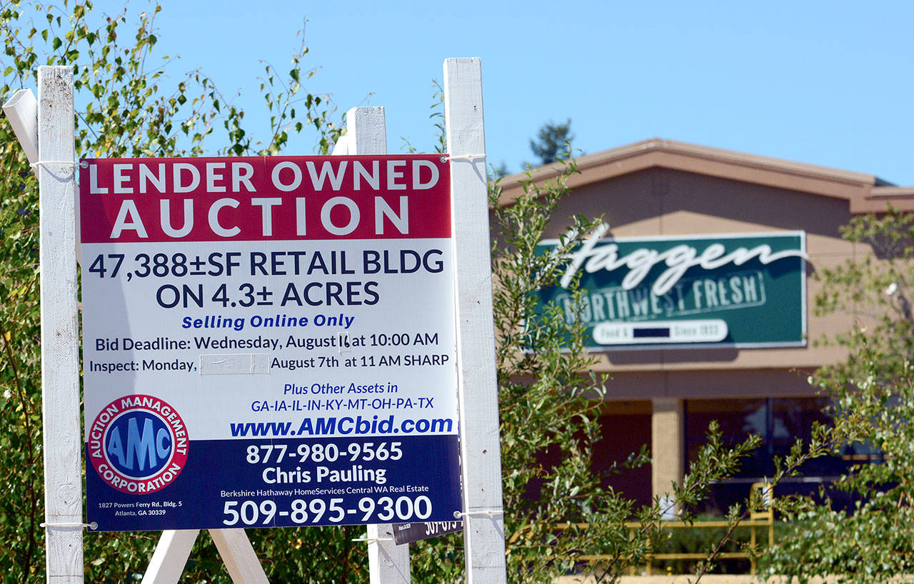 The shuttered Haggen Food & Pharmacy building at 114 E Lauridsen Blvd will be up for auction Aug. 9. (Jesse Major/Peninsula Daily News)