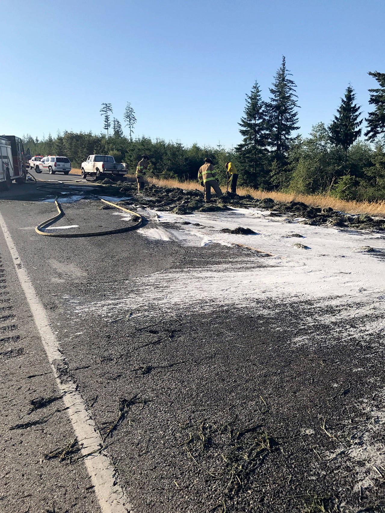 Ten bales of hay in the back of a pickup truck heading west on state Highway 104 caught fire Monday evening just east of Sandy Shore Road. Smoke from the fire halted traffic in both directions of the highway for about 30 minutes.
