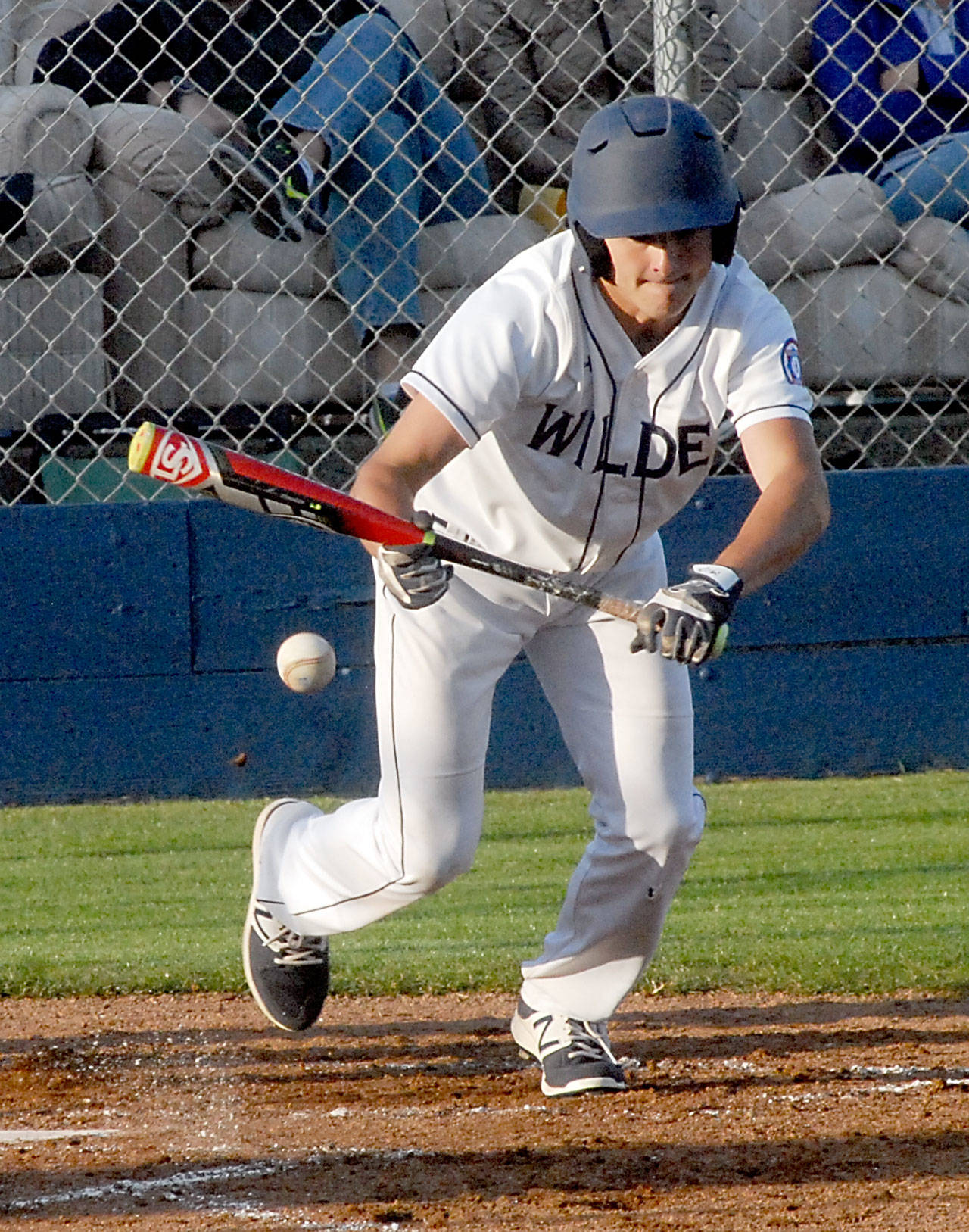 Carson Jackson of the Wilder senior team bunts in the third inning Friday evening against Lakeside Recovery at Port Angeles Civic Field. (Keith Thorpe/Peninsula Daily News)