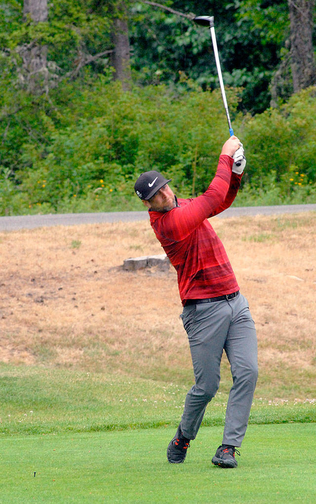 Keith Thorpe/Peninsula Daily News Casey Northern of Port Angeles tees off on the first hole on Friday at Peninsula Golf Club in Port Angeles during the Clallam County Amateur Tournament.