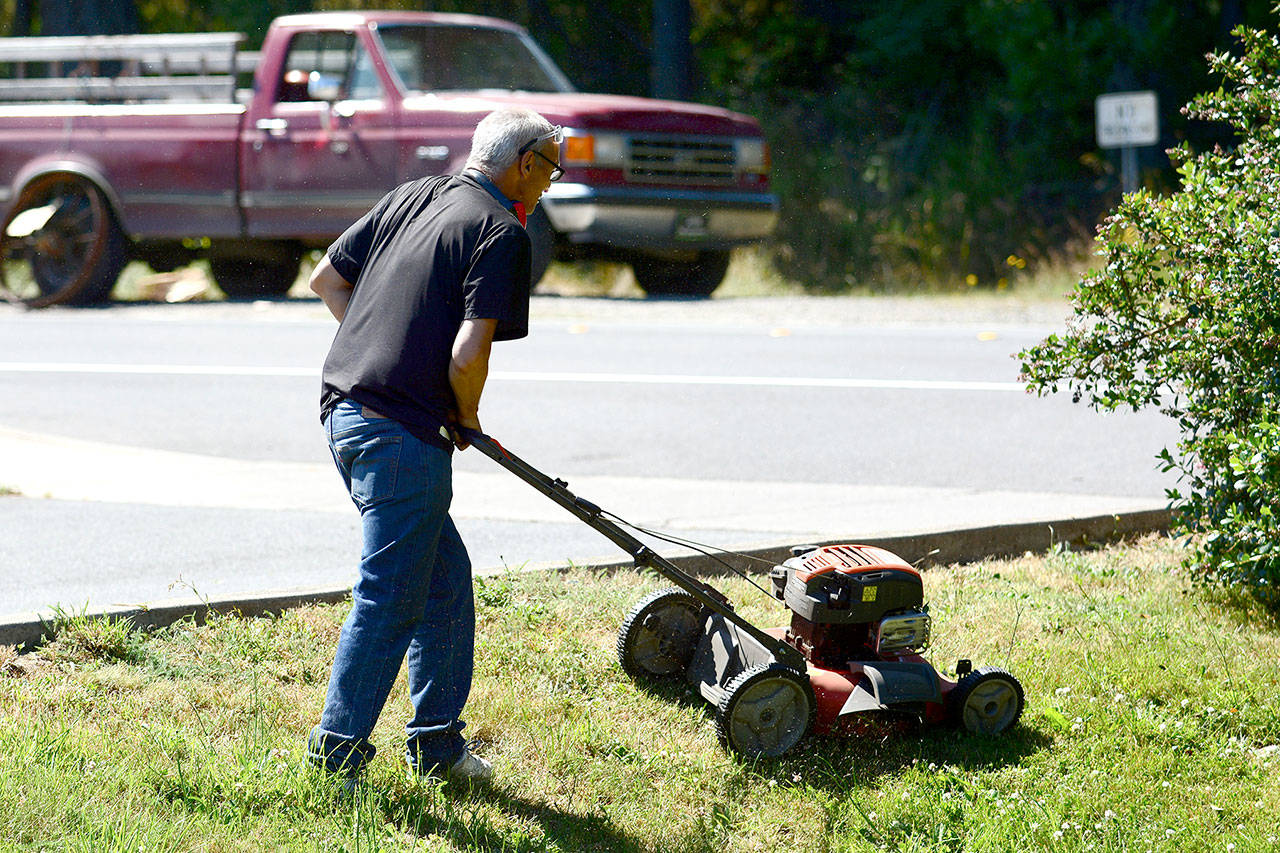 David, who asked not to include his last name, works at Serenity House on Monday as part of the nonprofit’s program aimed at putting panhandlers to work. (Jesse Major/Peninsula Daily News) 
