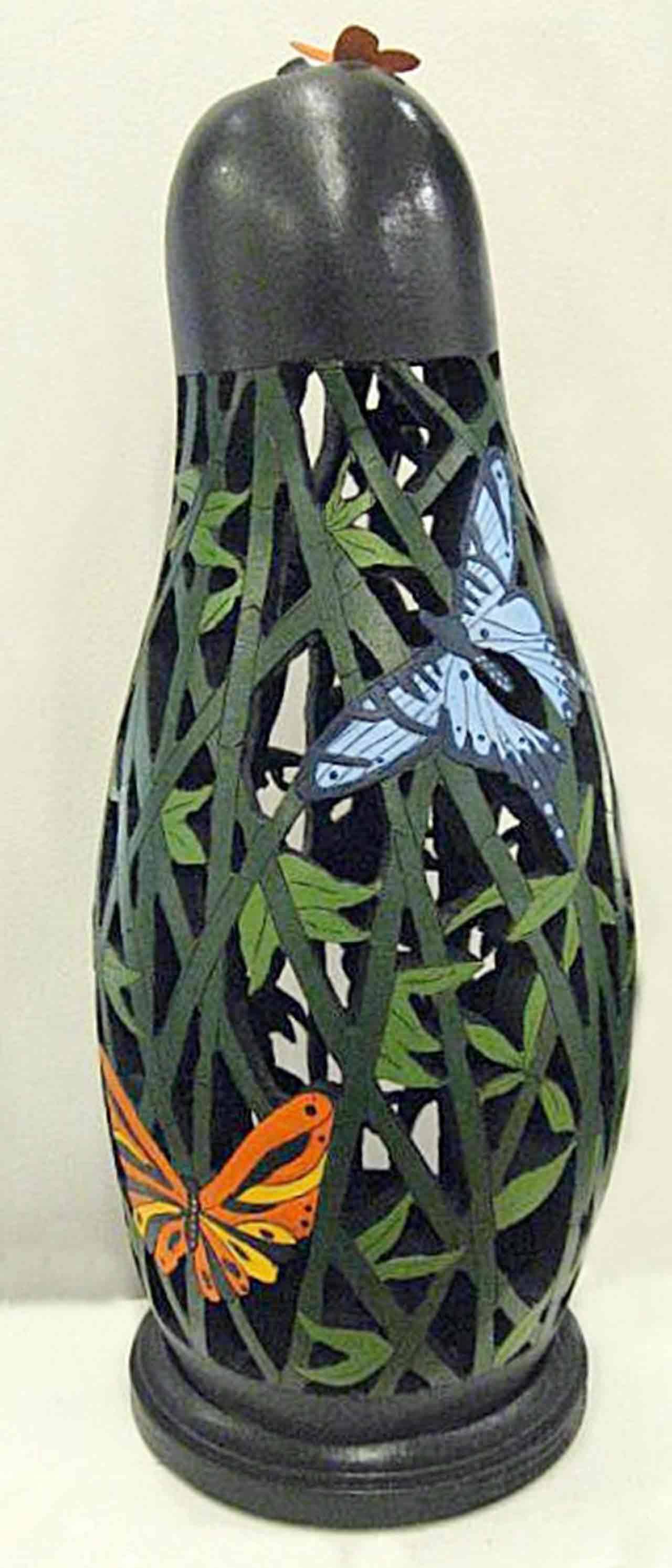 “Rainforest” is one of Debbie Cain’s art pieces that will be on display at the Blue Whole Gallery. At far right, “Mellow Yellow” by Priscilla Patterson will be on view at the Sequim Museum & Arts Center. Below right, photographs by Karen Rozbicki Stringer, such as this one named “Portals,” will be on display at the Blue Whole Gallery.