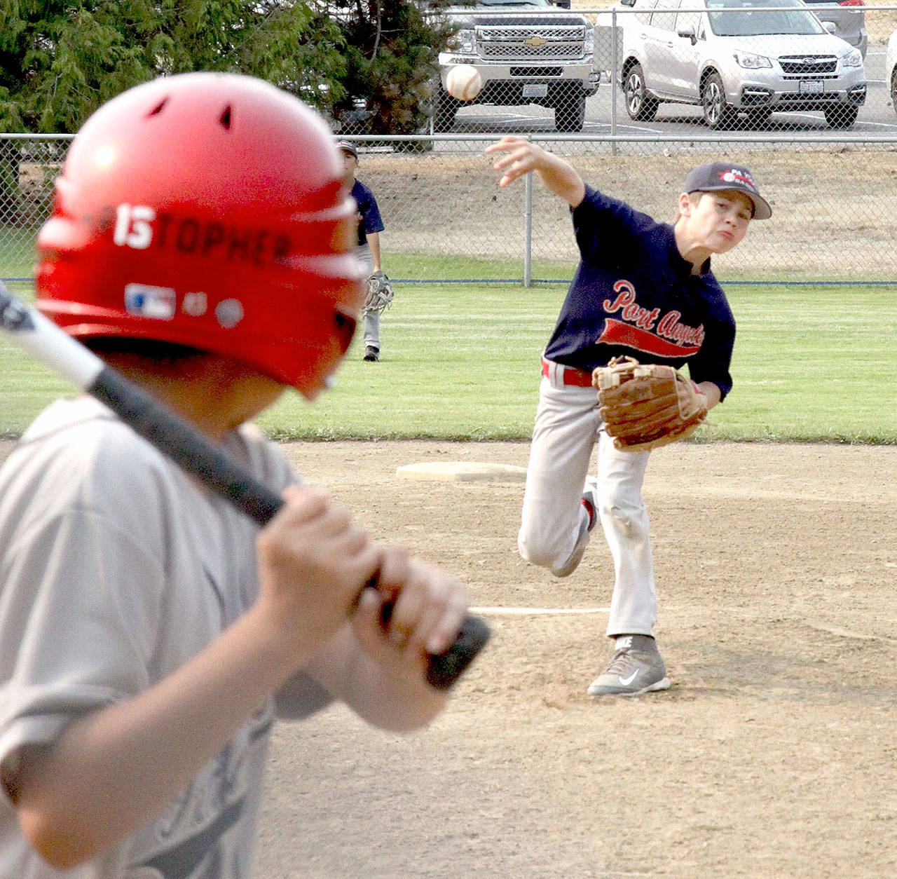 The Port Angeles 10U baseball team captured first place in its age division at the Dick Brown Memorial Tournament this weekend, beating Radiator Whiskey 6-0 in the title game. The tournament had 19 teams in 10-, 11- and 12-year-old Cal Ripken divisions playing at the Lincoln Park fields. Other teams came from Bellingham, Redmond, Puyallup, Hoquiam, Lacey and West Seattle. In the 10U championship game, Port Angeles starting and winning pitcher Alex Angevine throws to a Radiator Whiskey player at the plate.
