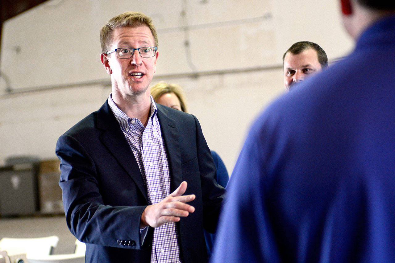 U.S. Rep. Derek Kilmer, D-Gig Harbor, asks a question during his visit to Airborne ECS in Port Angeles on Tuesday. (Jesse Major/Peninsula Daily News)​