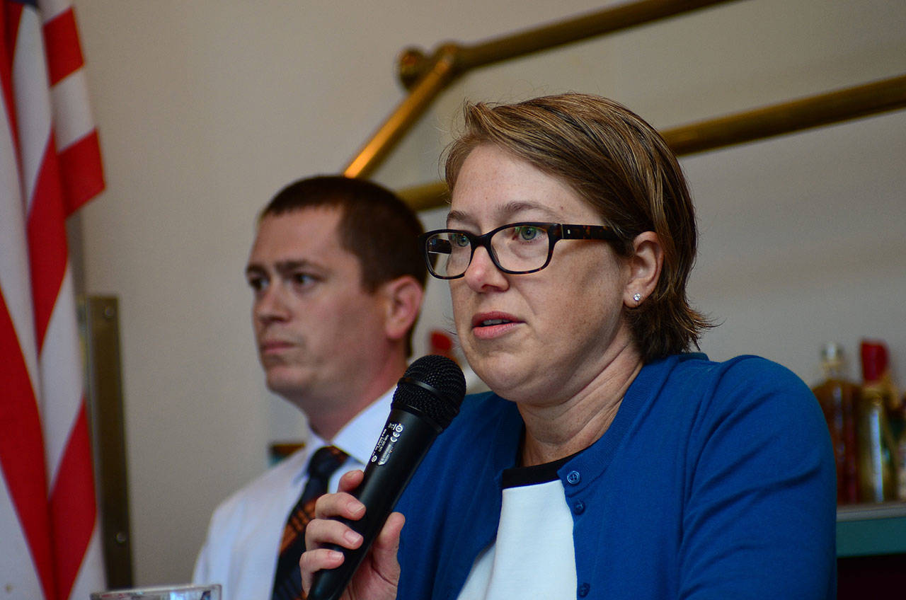 Port Angeles City Council hopefuls Kate Dexter and Travis Berglund answer questions during a Port Angeles Business Association forum Tuesday. (Jesse Major/Peninsula Daily News)