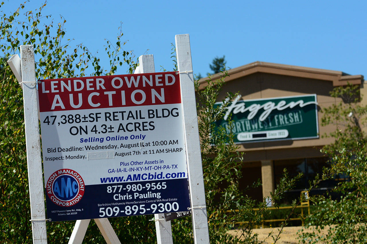 The shuttered Haggen Food & Pharmacy building at 114 E. Lauridsen Blvd. was auctioned Wednesday. (Jesse Major/Peninsula Daily News)